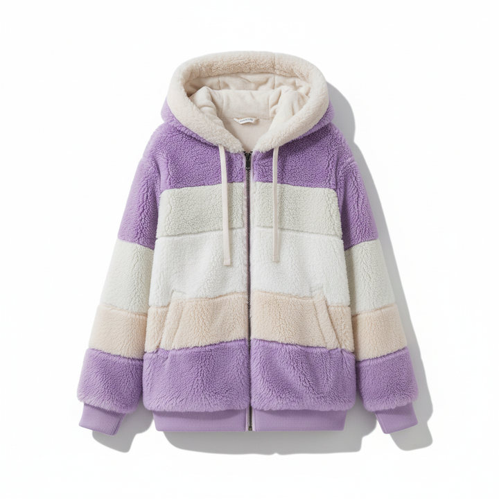 Woman's hand touching the plush fleece material of the oversized hooded vest, comfort focus