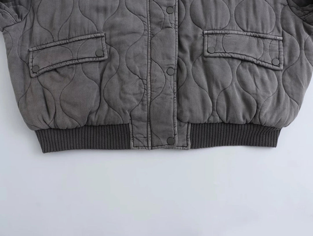 Versatile women's gray oversized bomber jacket, essential outerwear for a chic casual wardrobe.