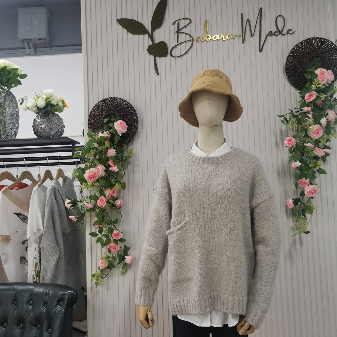 Warm women's oversized knit sweater, a versatile piece for autumn comfort & stylish casual clothing.
