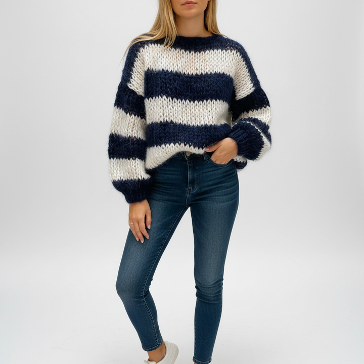 Striped knit oversized sweater for women, featuring a comfortable fit and soft fabric texture.