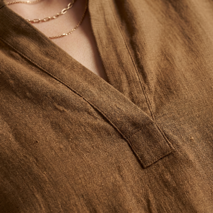 Loose-fit women's linen blend tunic with a flowy design, great for casual elegance.