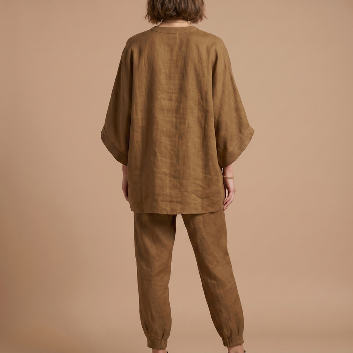 Stylish women's oversized linen blend top, perfect for resort, travel, or sophisticated casual outfits.