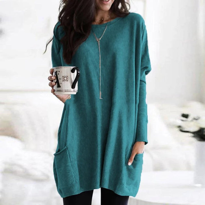 Plus size friendly women's oversized long sleeve tunic top with pockets, for a relaxed casual feel.