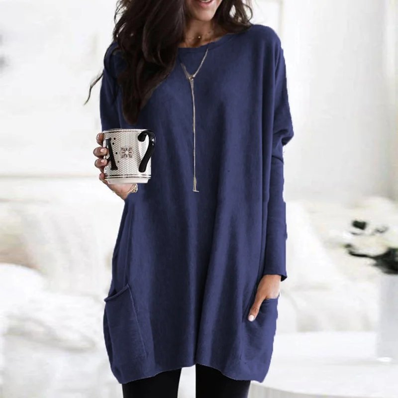 Practical women's oversized long sleeve tunic with side pockets, an easy-to-wear casual top.