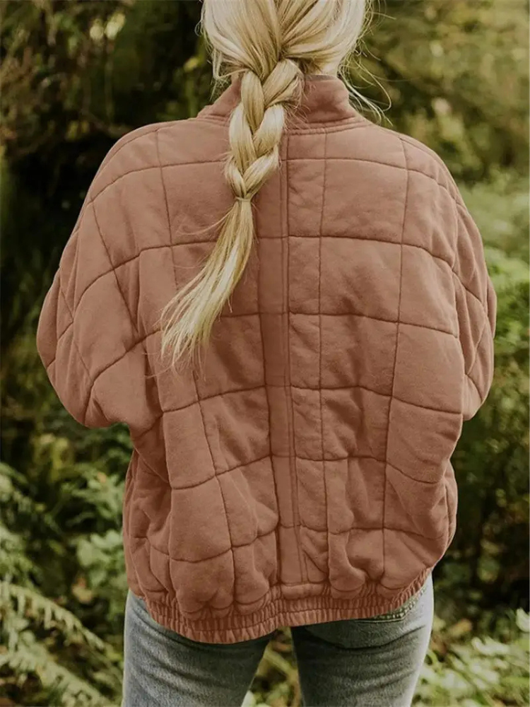 Warm oversized padded jacket for ladies, suitable for spring outerwear.