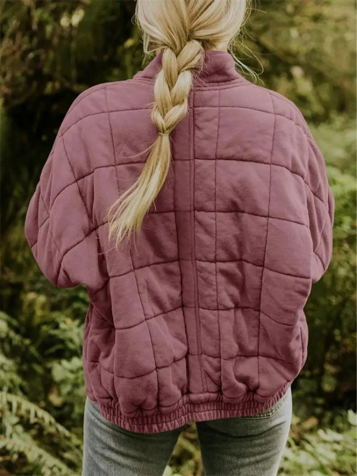 Warm oversized padded jacket for women, perfect for seasonal comfort.