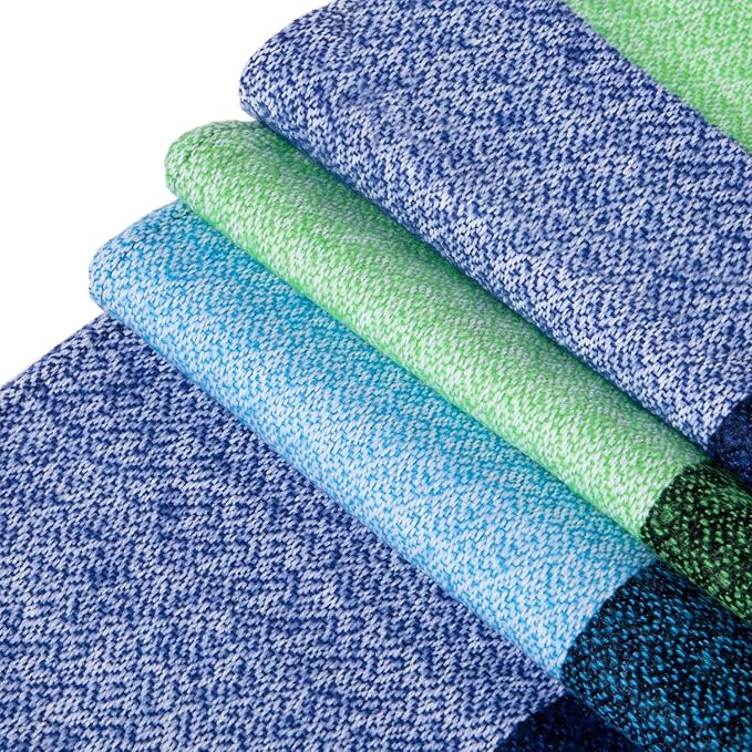 Close-up of the soft, woven texture of a women's cozy plaid oversized winter scarf.