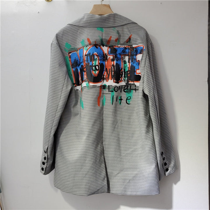 Chic women's oversized printed blazer; a versatile statement jacket with pocket for casual or workwear.