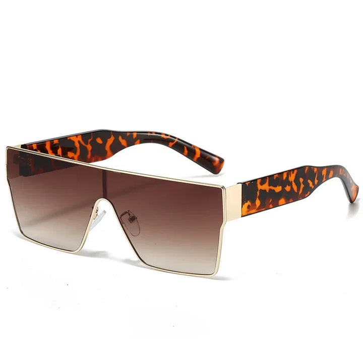 Stylish women's oversized shield sunglasses. Gradient lenses offer UV protection, a must-have fashion accessory.