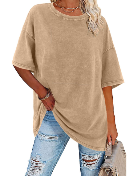 Woman wearing a relaxed fit oversized shirt, ideal for casual summer days or a stylish beach look. Comfy.