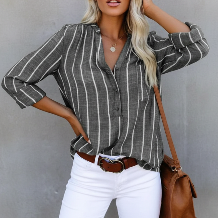 Modern women's oversized striped fashion blouse, a versatile long sleeve top for chic style.