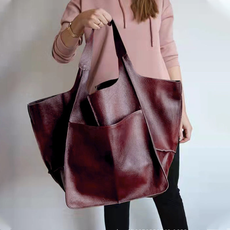 Spacious brown oversized travel bag for women, perfect for weekend getaways.