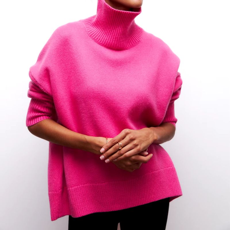 Relaxed fit women's oversized turtleneck sweater in soft knit for ultimate warmth.