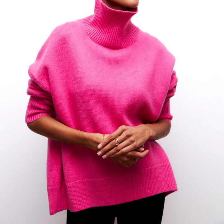 Relaxed fit women's oversized turtleneck sweater in soft knit for ultimate warmth.
