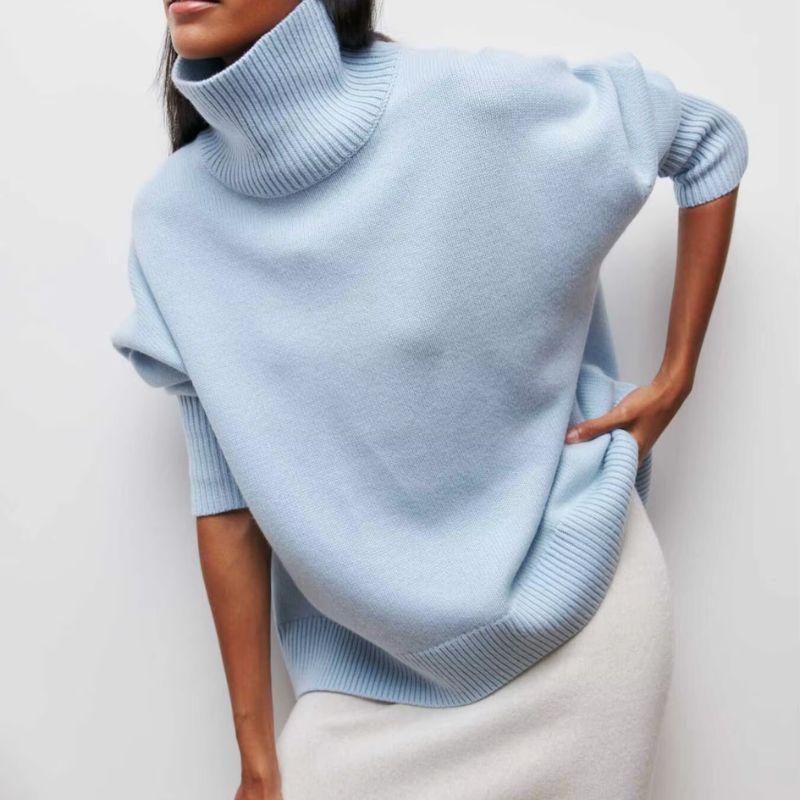 Stylish women's long sleeve turtleneck sweater, perfect for casual layering in winter.