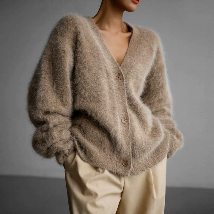 Women's oversized V-neck cardigan with button front, ideal for cozy, stylish layering.