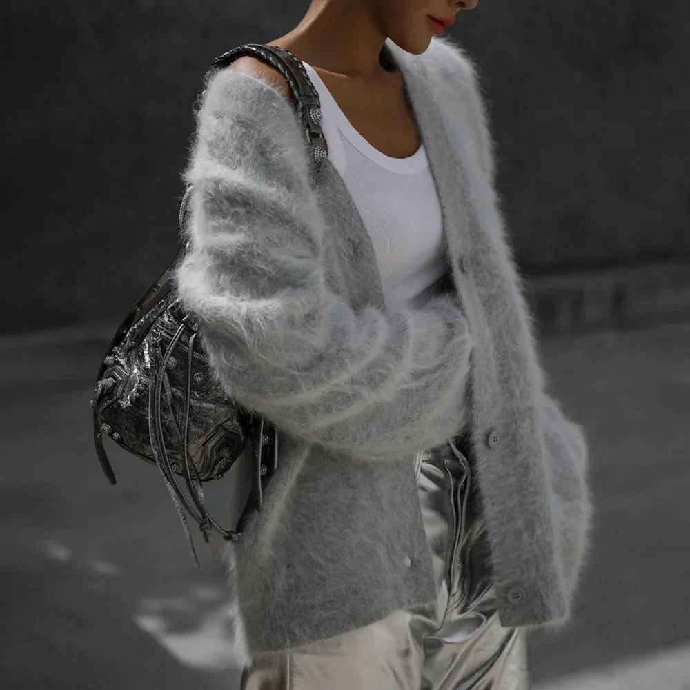 Comfortable women's oversized V-neck cardigan featuring a relaxed fit and long sleeves.