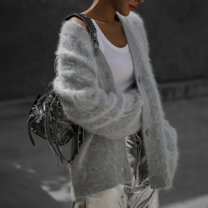 Comfortable women's oversized V-neck cardigan featuring a relaxed fit and long sleeves.