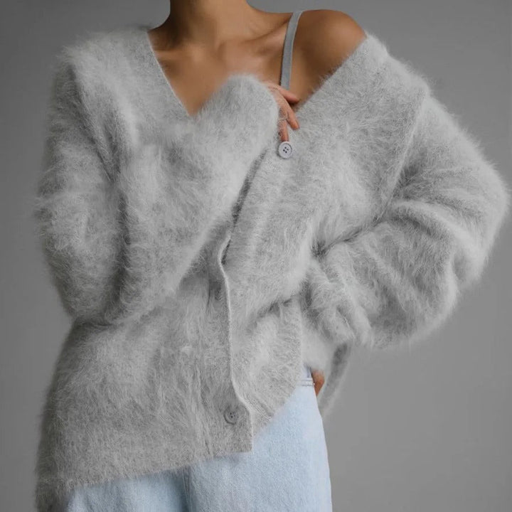 Trendy women's oversized V-neck button-front cardigan, perfect for a cozy and fashionable look.