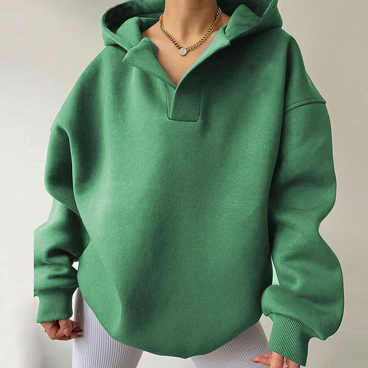 Women's oversized v-neck hoodie, perfect for cozy comfort and relaxed everyday wear. Long sleeve pullover for fall.