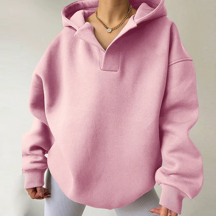 Fall fashion women's oversized v-neck hoodie. Stylish, cozy pullover with long sleeves for winter comfort and casual wear.
