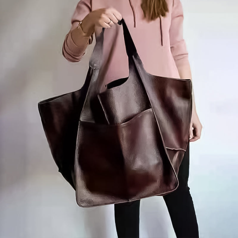 Women's oversized vintage leather shoulder bag, a versatile and stylish everyday carry accessory.