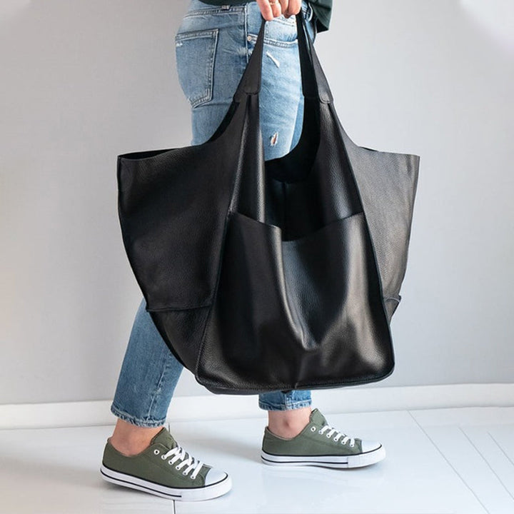 Spacious women's vintage oversized leather shoulder bag, ideal for everyday essentials & fashion.