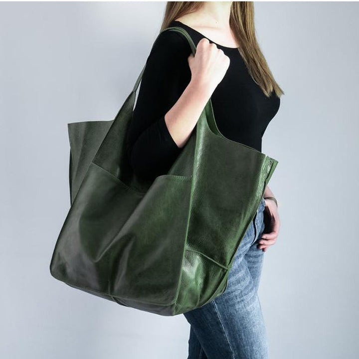 Classic vintage style women's oversized leather shoulder bag, an elegant & versatile fashion accessory.
