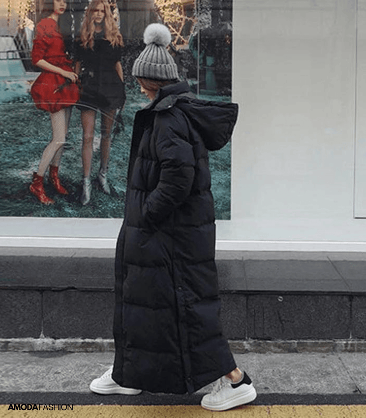 Warm & windproof oversized women's winter parka; a chic cold weather fashion statement.