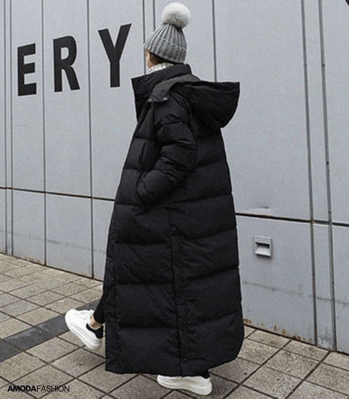 Elegant women's oversized parka for winter; comfortable, waterproof, and stylish cold weather jacket.