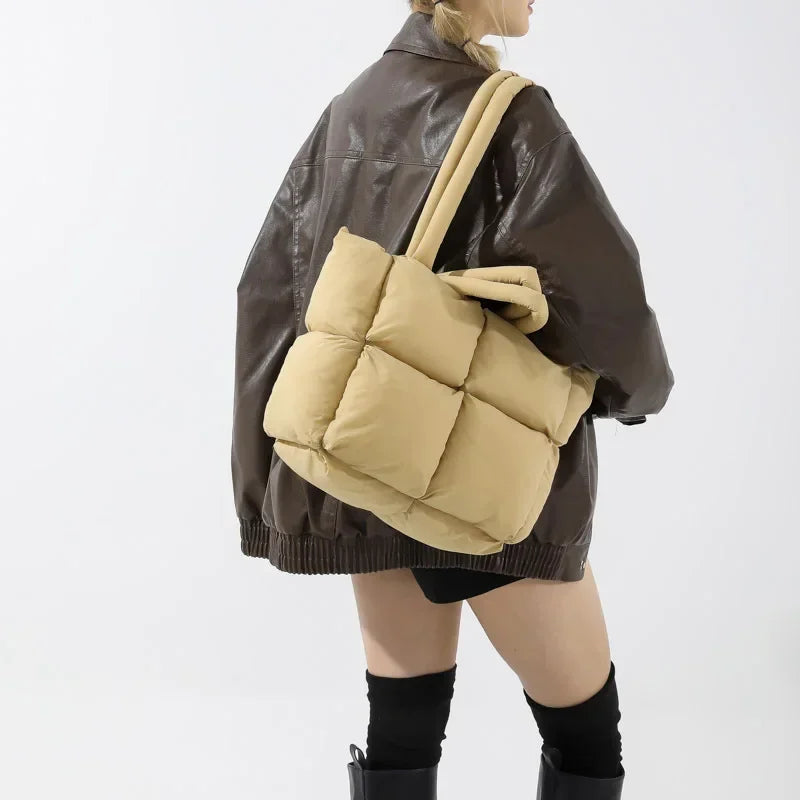 Soft padded Cloudline Puffer Tote for women; large capacity shoulder bag, a must-have fashion accessory.