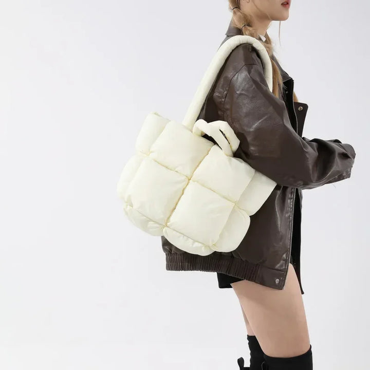 Versatile women's Padded Cloudline Puffer Tote; a soft shoulder bag, large capacity fashion accessory.