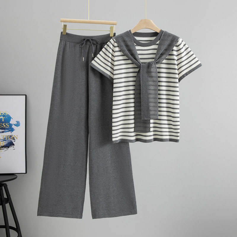 Parisian aesthetic striped two-piece lounge set for women. Soft cotton blend top and wide-leg pants for comfort.