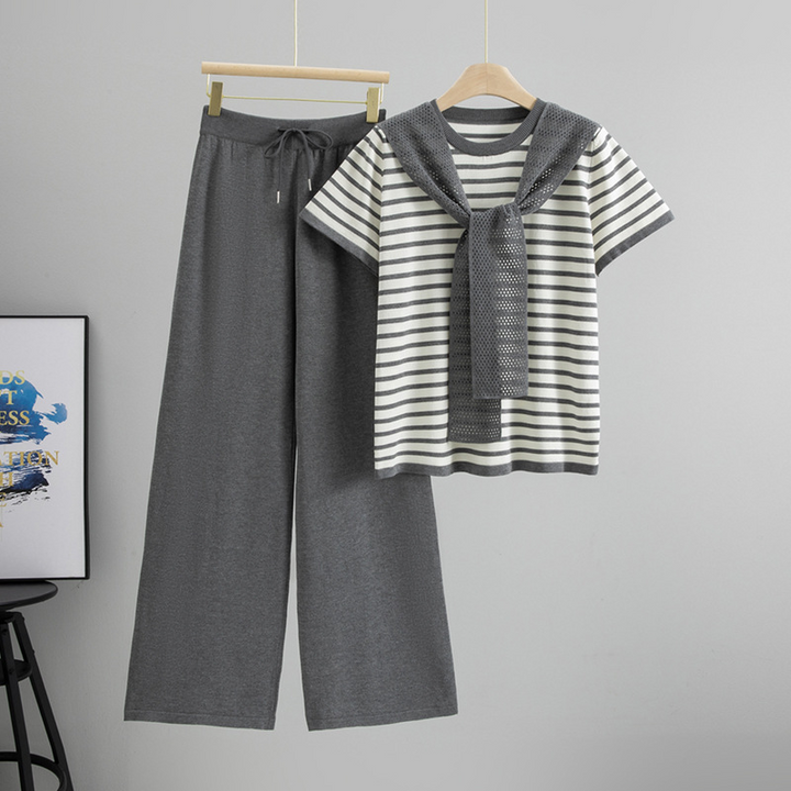 Parisian aesthetic striped two-piece lounge set for women. Soft cotton blend top and wide-leg pants for comfort.