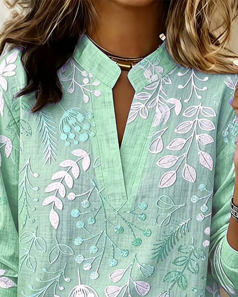 Work-appropriate women's pastel floral V-neck blouse, professional yet stylish for the office.