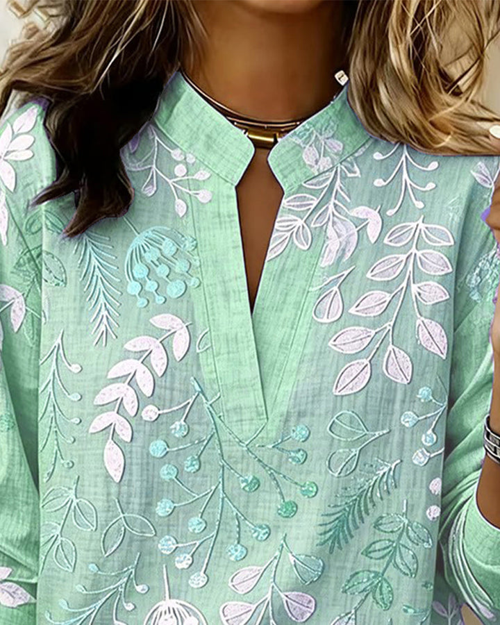 Work-appropriate women's pastel floral V-neck blouse, professional yet stylish for the office.
