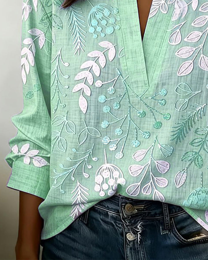 Flowy women's pastel floral V-neck top, designed for a relaxed yet elegant spring/summer vibe.