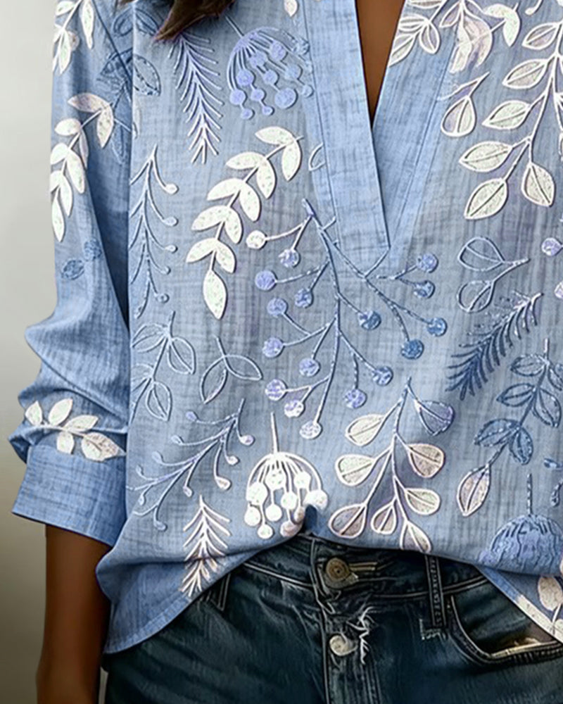 Chic women's pastel floral V-neck blouse, embracing spring style with vibrant, soft hues.