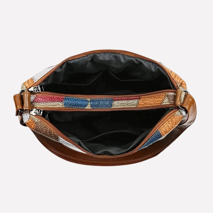 Elegant women's patchwork shoulder bag featuring braided accents. A perfect fashion accessory.