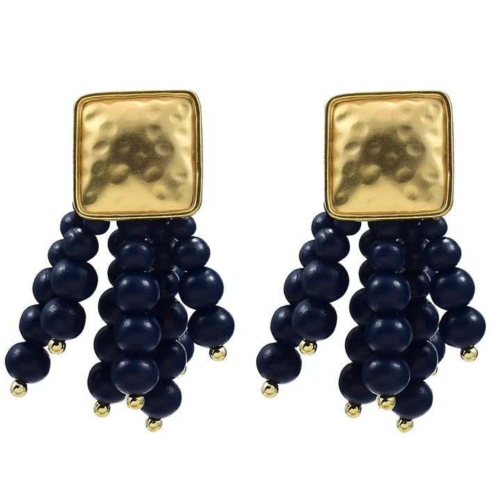 Women's pearl-shaped wooden chain drop earrings. Unique handmade natural jewelry for boho fashion.