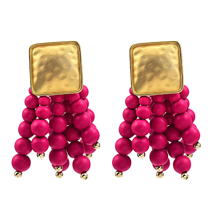 Elegant pearl-shaped wooden drop earrings. Unique handmade natural jewelry, perfect for women's boho style.