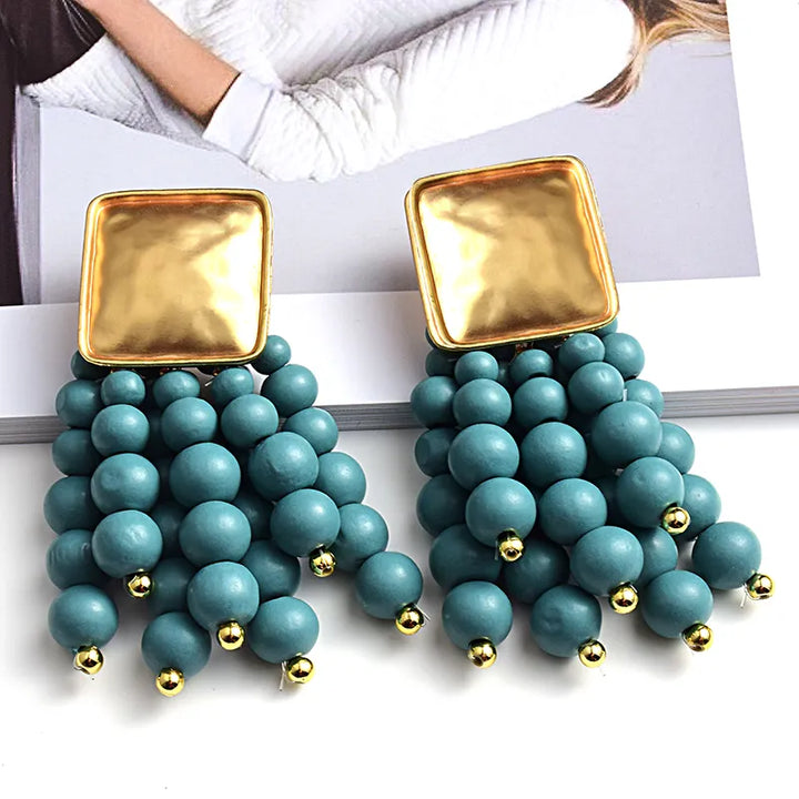 Boho statement wooden drop earrings with pearl shape. Unique handmade jewelry for women's fashion.