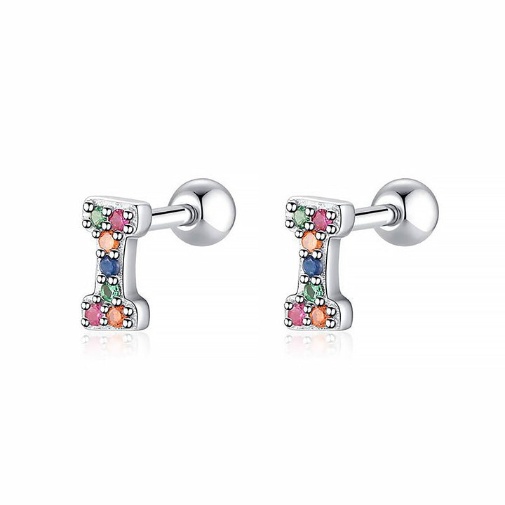 Pair of personalized sterling silver initial hoop earrings, elegant women's gift.