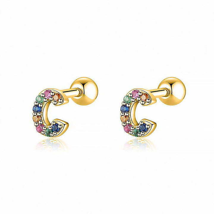 Close-up of gold plated personalized 'D' initial hoop earrings, stylish women's jewelry.