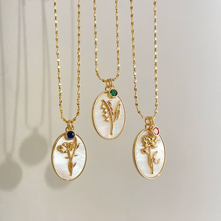 Women's personalized silver necklace with birthstone & custom birth flower charm. Perfect gift.