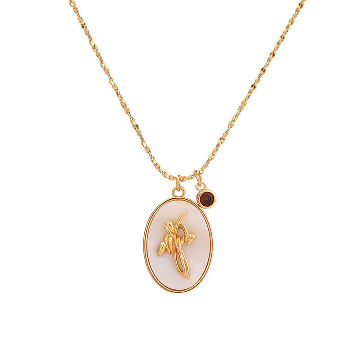 Elegant women's personalized birth flower necklace, silver, with sparkling birthstone accent.