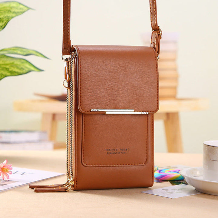 Women's phone shoulder bag with clear touchscreen compartment for easy phone access.
