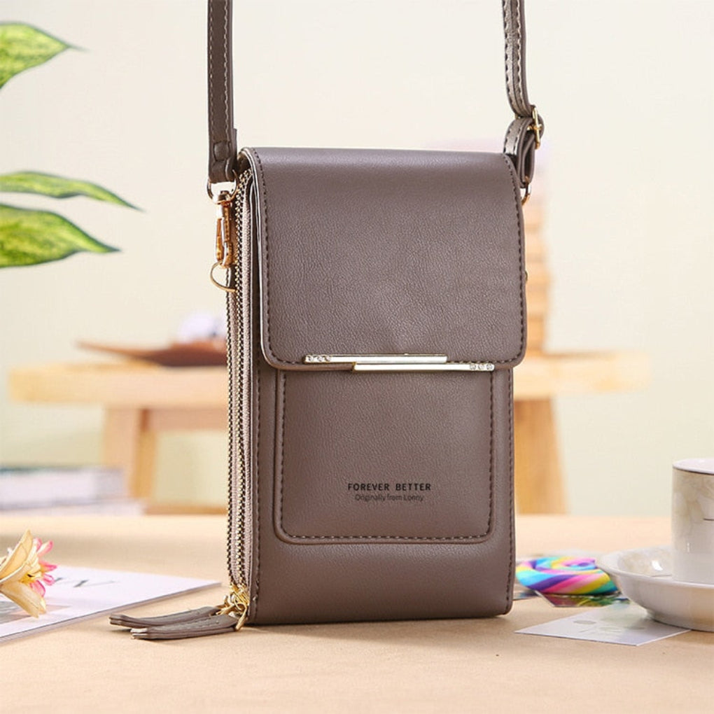 Versatile women's travel phone shoulder bag with a secure touchscreen compartment.