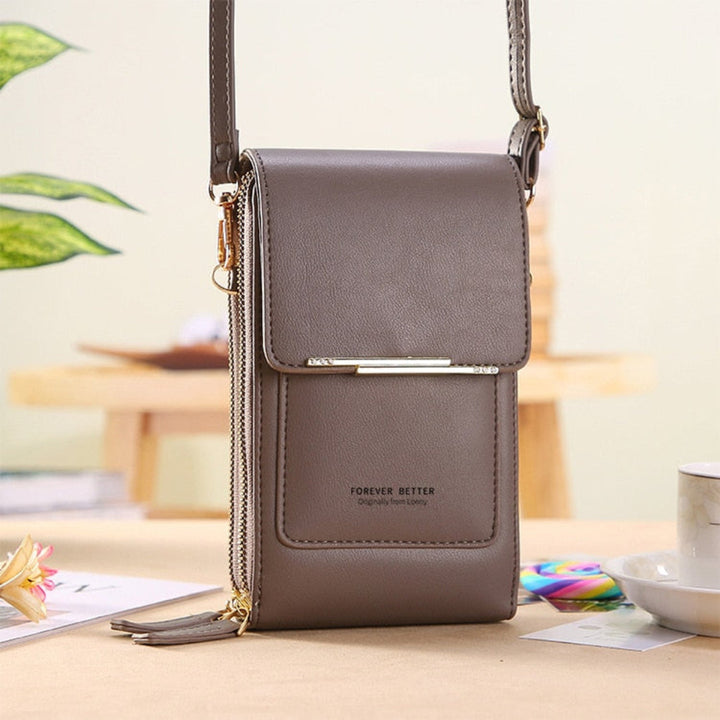 Versatile women's travel phone shoulder bag with a secure touchscreen compartment.
