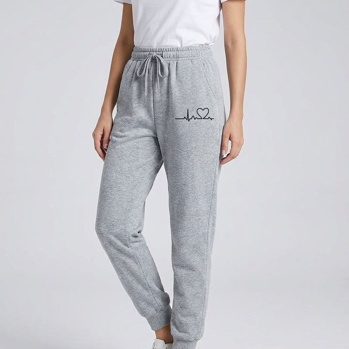 Close-up of heart detail on women's cotton sports trousers, ideal for activewear or casual wear